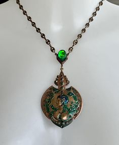 I have made this pendant necklace with vintage pieces it's quite a rare piece with a beautiful peacock lady  I have painted and sealed the pendant for wear  Above the pendant I have added a beautiful foil stone that shines blue/ green which sets off the peacock colours Peacock Colours, Design Art Nouveau, Beautiful Peacock, Peacock Color, The Peacock, Art Nouveau Design, Vintage Pieces, Favorite Jewelry, Vintage Art