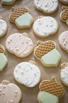 many decorated cookies sitting on top of a table