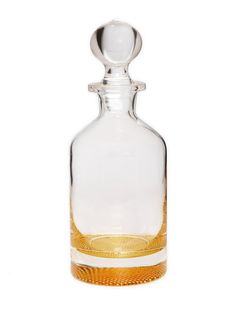 an empty glass bottle with a metal stopper on the top is sitting in front of a white background