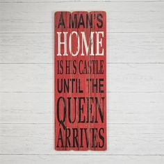 a wooden sign that says,'home is his castle until the queen arrives '