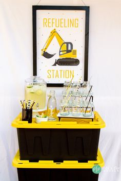 there is a yellow cart with drinks on it and a sign above it that says refueling station