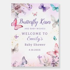 a welcome sign for a baby shower with butterflies and flowers on the front, in pastel pink