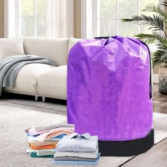 a large purple bag sitting on top of a white rug