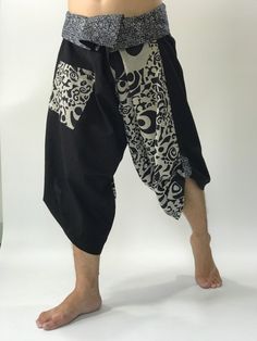 "These special design harem pants have fisherman pants style wrap around waist and belt, totally unlike anything before them. The main fabric is made from pre-washed soft cotton with subtle texture. The foldover waist is made from vintage handmade fabric brought from hill tribes in northern Thailand, so they are totally unique. There is one side pocket for your essentials. The hem has matching pull-up tabs for added personality. These performance pants are designs for extreme mobility, perfect f Japanese Harem Pants, Ankle-length Harem Pants With Side Pockets, Black Wide-leg Harem Pants With Side Pockets, Men’s Harem Pants, Yoga Harem Pants, Unique Pants, Samurai Pants, Handmade Pants, Thai Fisherman Pants