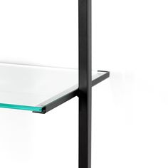 a glass shelf with a black metal frame