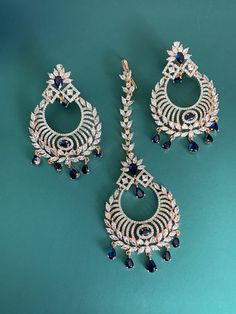 American diamond chandbali style earring with Tikka. Push back , light weight earring is about 3 inch long and Tikka 21/2. Luxury Chandbali Bridal Earrings With Matching Design, Luxury Fusion Chandbali Bridal Earrings, Luxury Traditional American Diamond Danglers, Luxury Chandbali Bridal Sets For Festivals, Luxury Cutdana Chandbalis For Festivals, Cheap Festive Chandbali Danglers, Luxury Heavy Chandbalis For Diwali, Luxury Fusion Chandbalis For Reception, Luxury Chandbali Tikka For Diwali