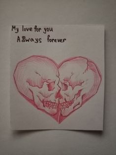 a drawing of two skulls in the shape of a heart