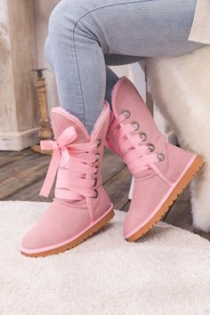 Stay warm in chic, eye-catching style when you pull on these genuine suede boots featuring plush faux fur-lining and bold ribbon laces. 1'' heel 11.8'' shaft 14.2'' circumference Pull-on Suede upper Faux fur lining Man-made sole Diy Crochet Shoes, Tie Up Boots, Cute Shoes Boots, Pink Suede Boots, Pink Ugg Boots, Uggs Boots, Pink Uggs, Ribbon Laces, Boots Cowgirl