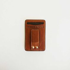 Our handmade men’s money clip is the perfect solution for those who want a simple wallet that isn’t too bulky, but is robust enough to hold everything you need— cash included. Featuring two front pockets with integrated thumb slot, a hidden rear pocket for those “always need but rarely use” insurance cards and the like, and the strongest magnets we were able to fit into a wallet of this size. Handcrafted to complement a guy of any age. Premium Horween full-grain leather and robust stitching for Classic Trifold Wallet With Cell Phone Pocket For Everyday, Rfid Blocking Rectangular Wallet For Everyday Carry, Rfid Blocking Everyday Rectangular Wallet, Classic Rectangular Everyday Card Holder, Rfid Blocking Everyday Wallet, Rectangular Trifold Wallet With Belt Clip For Everyday Use, Everyday Use Trifold Wallet With Belt Clip, Classic Card Holder For Everyday Carry, Rectangular Wallets With Cell Phone Pocket For Everyday