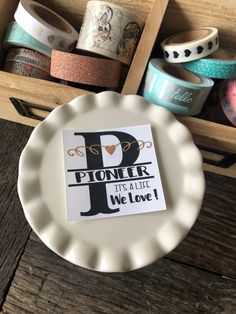 a paper plate with the letter p on it next to some washi tapes and other crafting supplies