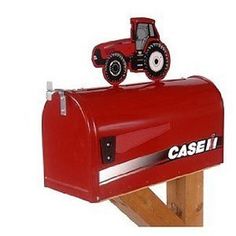 a red mailbox with a tractor on top and the word case it written in black