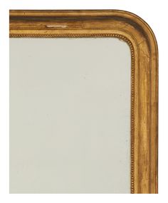 an antique gold framed mirror with beading around the edges, on a white background