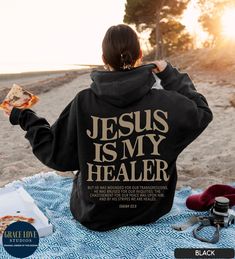 "Jesus is My Healer, Jesus Hoodie, Christian Hoodie 👉 QUICK FACTS 👈 50% cotton/ 50% polyester fabric blend Runs true to size. Order 1-2 sizes up for an oversized fit. 👉HOW TO ORDER:👈 1. Please, Check and Review all Photos. 2. Select Your Size and Color from drop down menus. 3. Choose Your Quantity as much as you want. 4. Click \"Add To Cart\". For multiple items go back to the listing and repeat the steps. 👉Sizing Chart 👈 Use the sizing chart to understand the measurement of our Hoodies. 👉Care Instructions 👈 Machine wash: warm (max 40C or 105F); Bleach as needed; Tumble dry: medium; Iron, steam or dry: low heat; Do not dryclean. 👉Returns👈 All items are made-to-order. Because of the nature of these items, unless they arrive damaged or defective, I can't accept returns. DISCLAIMER: Christian Gift Shop, Cute Shirt Designs