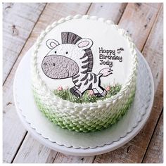 a birthday cake with an image of a zebra on it