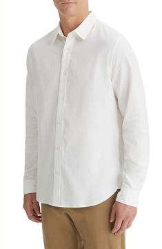 Lightweight and comfortable, this shirt made of cotton and lyocell sports a touch of stretch and a relaxed fit that looks great whether it's tucked or untucked. 30" length; 44" chest (size Medium) Front button closure Spread collar Long sleeves with one-button cuffs 72% cotton, 26% lyocell, 2% elastane Machine wash, tumble dry Imported Relaxed Fit Cotton Shirt With Button Closure, Slim Fit Solid Cotton Shirt, White Unstructured Button-up Top, Unstructured White Button-up Top, Slim Fit Cotton Shirt, Solid Cotton Slim Fit Shirt, Casual Cotton Shirt With Shirttail Hem, Modern Cotton Shirt For Casual Gatherings, White Fitted Shirt For Casual Gatherings