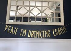 a party banner that says yeah i'm drinking lamant hanging from the ceiling