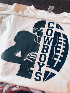 a t - shirt with the words cowboys on it and a silhouette of a football player