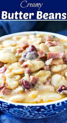 creamy butter beans with ham in a blue and white bowl on top of a blue cloth