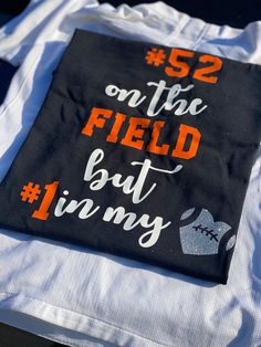 a t - shirt that says 52 on the field but i'm my number