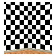 an empty room with black and white checkerboard wallpaper on the walls, in front of a wooden floor