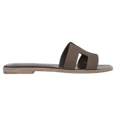 Mightychic offers Hermes Oran sandal shoes featured in neutral Etoupe Epsom leather. The iconic top stitched H cutout over the top of the slide. Matching embossed calfskin insole. Wood heel with leather sole. Comes with sleepers and signature Hermes box. Please see our extensive collection of Hermes Oran sandals available. NEW or NEVER WORN. final sale SIZE 39 USA SIZE 9 CONDITION: NEW or NEVER WORN Brown Formal Shoes, Hermes Oran Sandals, Ysl Shoes, Modernist Jewelry, Sandal Shoes, Hermes Oran, Kelly Bag, Wood Heel, Jane Birkin