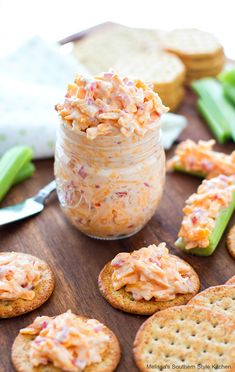 crackers and dip in a jar on a table