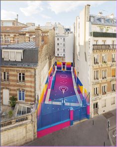 an aerial view of a basketball court painted on the side of buildings in paris, france