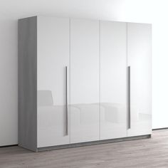 a white and grey cabinet with two doors on the front, one door open to reveal a bed