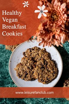 healthy vegan breakfast cookies on a white plate with flowers in the background and text overlay