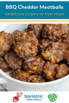 a white bowl filled with meatballs on top of a table