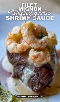 there is a plate with food on it and the caption reads, filet and mingon whiskey garlic shrimp sauce or whatever you do