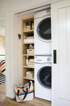 a laundry room with a washer and dryer in the closet next to it