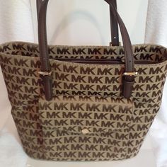 New With Tags. Never Used. Never Worn. Plenty Of Pockets. Nice Bag With Lots Of Areas To Organize Your Stuff. Please Ask Any Questions Prior To Purchase. No Remorseful Buyers Please. (Located In Base 130) Michael Kors Brown Coated Canvas Bag, Michael Kors Brown Shoulder Bag For Travel, Michael Kors Brown Everyday Bags, Michael Kors Brown Everyday Shoulder Bag, Michael Kors Casual Tote Bag, Michael Kors Brown Shoulder Bag For Shopping, Michael Kors Brown Casual Bag, Casual Brown Michael Kors Bag, Bags Michael Kors