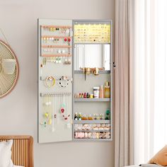 a wall mounted jewelry organizer in a bedroom