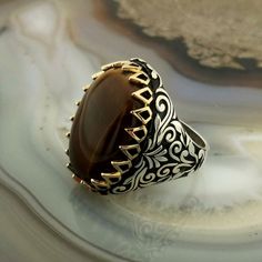 The ring is made of 925 sterling silver, decorated with stunning Tiger Eye Stone . PRODUCT FEATURES -Products are shipped with free shipping along with the box and bag. - Production Mine: 925 Sterling Silver - Weight: 20,5 grams - Stone: Tiger Eye -Stone size: 18x25 mm All products come in a special gift box. If you don't see your size, please ask, we can produce your size. You are looking at high quality handcrafted silver ring. All our products are designed and produced by ourselves. Your feed Handmade Brown Signet Ring For Gift, Handmade Brown Signet Ring As Gift, Bronze Nails, Tiger Eye Stone, Silver Man, Tiger Eye, Class Ring, Ring, Special Gifts