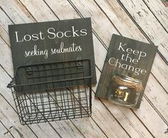 two books sitting next to each other on top of a wooden floor with wire baskets