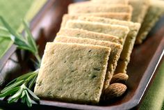 crackers on a plate with rosemary sprigs