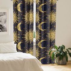 the sun and moon curtains are hanging in front of a window