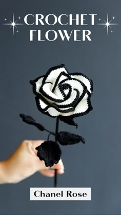 a crochet flower is being held by a person's hand, with the words crochet flower on it