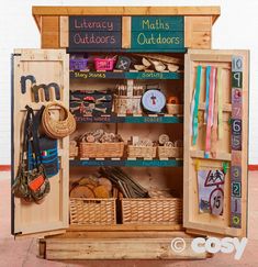 a wooden cabinet with lots of items in it and the words maths & english combs