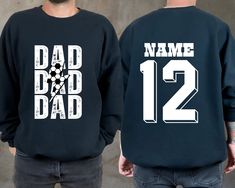 "Personalized Soccer Dad Sweatshirt, Custom Soccer Papa Sweater, Cheer Dad Shirt, Game Day Shirt, Sports Dad Hoodie, Custom Name Shirt This is Moko Shirt!   -Don't forget to see all the photos in listings for details like print color options and sizes and shirt colors.  -Use the drop-down menus to notify the sizes and colors of your shirts.  -Prices vary depend on the shirt sizes.  -Shirts are soft and regular relax fit. Below there are some information about my products and shop.  -Sweatshirt M Black Sporty Sweatshirt With Name Print, Sporty Black Sweatshirt With Name Print, Crew Neck Hoodie With Letter Print For Team Events, Black Sweatshirt With Name Print For Sports Events, Long Sleeve Graphic Print Sweatshirt For Team Events, Pre-shrunk Crew Neck Sweatshirt For Team Events, Winter Team Events Crew Neck Sweatshirt, Black Sweatshirt With Letter Print For Team Events, Black Sweatshirt For Team Events