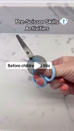 a person holding a pair of scissors in their hand with text reading pre - scissors skills activities before children 3 this