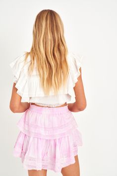 Our best selling Ruffle Mini Skirt returns for the season. She features intricate inset lace trims and allover pintuck details. The elasticated waistband and double lining offers flexibility in comfort and styling. Tiered ruffles exude effortless femininity. The mini is finished with a frayed, raw hem for added playfulness. Complete the look with our Nora Top. *Due to the nature of the hand dye process, colors may vary from what is pictured.