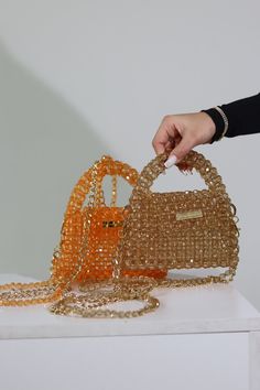 Elevate your fashion with this luxurious orange and brown beaded bag, meticulously adorned with dazzling crystals. Its elegant design makes it a perfect gift, adding a touch of sophistication to any outfit. Crystal Bead Bag, Beads Purse, Bead Bag, Valley Village, Beaded Bag, Beaded Purses, Back Shoulder, Beaded Bags, Cross Body Handbags