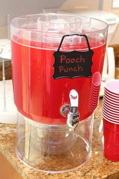 a red soda machine sitting on top of a counter