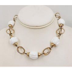 This is part of Chairish’s Costume Jewelry assortment.  1950s Modernist goldtone and white glass necklace with hook clasp. Marked "Napier." Measures: 5 1/2 inches long by 5 1/4 inches wide. Center; 11/16 inches long. Condition: Some minor wear to goldtone throughout, a few tiny dots on white beads. White Single Strand Glass Necklace, Vintage White Necklaces For Formal Occasions, White Vintage Necklace For Formal Occasions, Vintage White Metal Jewelry, Vintage White Single Strand Necklace, Formal White Glass Jewelry, Vintage White Glass Jewelry, Modern Branding, Hook Clasp