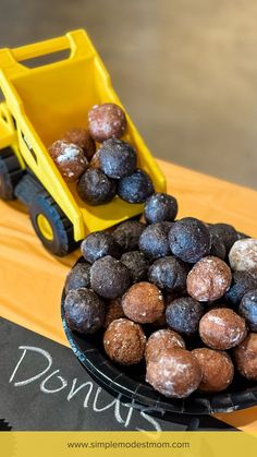 donut holes falling out of construction truck for construction theme birthday party Construction Baby Shower, Construction Cake