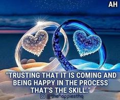 two heart shaped glass pieces on top of sand with the caption trusting that it is coming and being happy in the process that's the skill