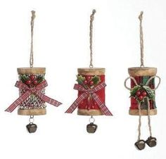 three bells with bows and bells attached to them