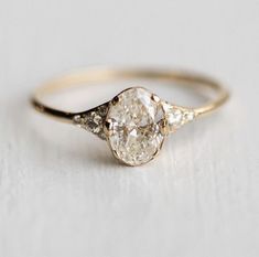 an engagement ring with three diamonds on it